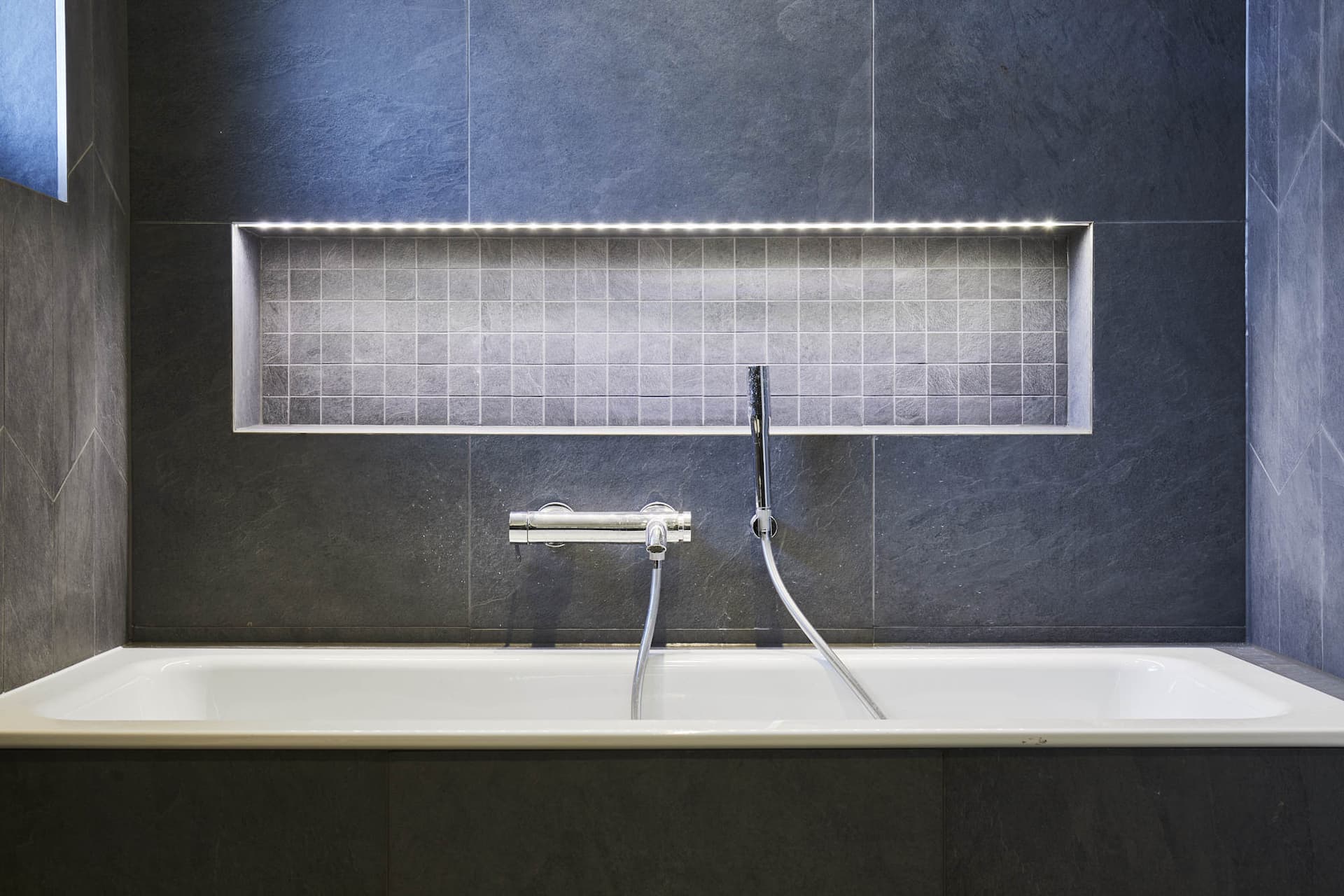 BPM39-Victorian-Penthouse-London-Chiswick-Bathroom-Grey-Italian-Tiles-Porcelain-Mosaic-Niche-Bathtub-Tap-LED-Strip_scaled_Y.jpeg
